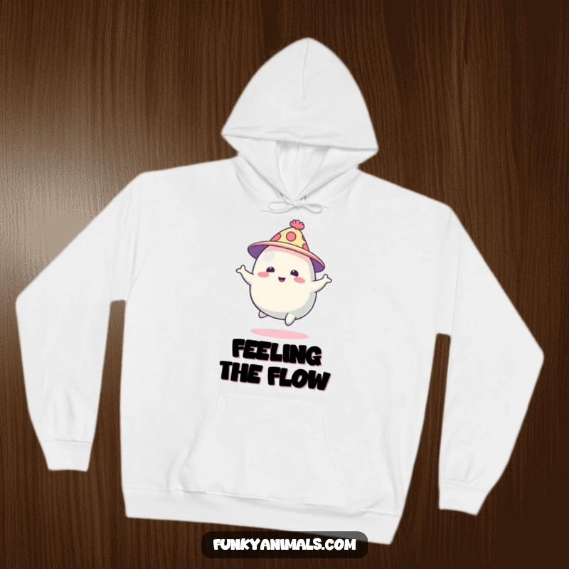 Funny abstract blob creature in a funky hat, bouncing energetically, printed on a soft hoodie, perfect for a cozy and humorous vibe.
